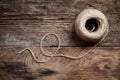 Rope coil on old wooden background Royalty Free Stock Photo