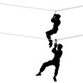 Rope crossing. The black silhouette of a young man climber tourist hanging on carabiners to a rope, two positions hang on a string