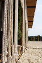 Rope curtain on a sandy beach Royalty Free Stock Photo