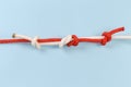 Rope fisherman knot with stopper knots on a blue background Royalty Free Stock Photo