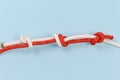 Rope fisherman knot with stopper knots on a blue background Royalty Free Stock Photo