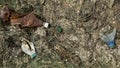 Rope fishing net with plastic garbage thrown out on sea beach