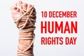 Rope on fist hand with 10 december HUMAN RIGHTS DAY text Royalty Free Stock Photo