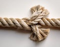 A rope fraying under tension, placed against a light backdrop emphasizing breaking points in fragile systems Royalty Free Stock Photo