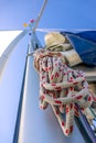 Rope Hank Hangs on the Mast of a Sailing Yacht and Blue Sky