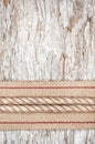 Rope and hardware ribbon on the old wood Royalty Free Stock Photo