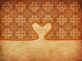 Rope heart on decorative paper Royalty Free Stock Photo