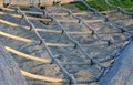 Rope hemp net connected in a wooden frame by means of metal stainless steel connectors. it is an attraction for children on the pl