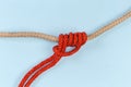 Rope klemheist knot on a blue background