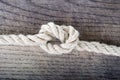 Rope knot as a strong nautical marine line tied together as a symbol for trust and strenght Royalty Free Stock Photo