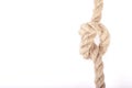 Rope knot as a strong nautical marine line tied together as a symbol for trust and strenght Royalty Free Stock Photo