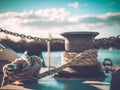 Rope knotted around steel pole for securing the boat Royalty Free Stock Photo