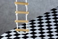Rope ladder and floor background black and white square cage.Rope ladder-wooden steps, convenience,simplicity,compactness, Royalty Free Stock Photo