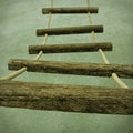 A rope ladder with wooden rungs Royalty Free Stock Photo