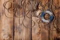 Rope and lifebuoy on old wooden burned table or board for background Royalty Free Stock Photo