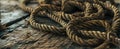 Rope lying discarded on wood floor web background Royalty Free Stock Photo