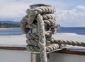 A rope made of synthetic material on a yacht against the background of the sea on a sunny summer day. Rigging on a pleasure yacht Royalty Free Stock Photo