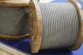 Rope metal steel on a wooden coil. Industrial wire cable