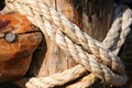 Rope, nail and wooden surface