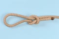 Rope Noose knot on a blue background Royalty Free Stock Photo