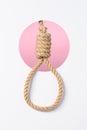 Rope noose with tight hangman knot layered white paper background Royalty Free Stock Photo