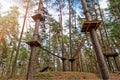 Rope obstacle track high in the trees in adventure park