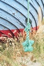 Rope of old fishing boat lying on the beach in Denmark