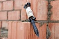 Rope plumb for even brickwork. Compliance with the correct laying of walls and corners of ceramic bricks. Bricklayer\'s tool Royalty Free Stock Photo