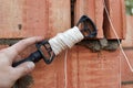 Rope plumb for even brickwork. Compliance with the correct laying of walls and corners of ceramic bricks. Bricklayer's tool Royalty Free Stock Photo