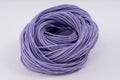 Rope, purple rubber rope. Twisted rope beautifully on a white background.