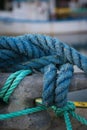 Rope securing boat to wharf. Knot securing fishing boat.