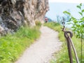 Rope and shackles anchored in hard dolomite limestone rock. Climbers path via ferrata Royalty Free Stock Photo