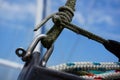 Rope on a ship tied with a metal harp voor safety and strenght. Royalty Free Stock Photo
