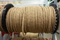 Rope on a show-window of shop. The rope is reeled up on the coil. Texture of a rope.