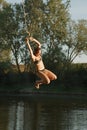 Rope swing river jump