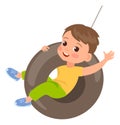 Rope swings. Kid swinging on wheel. Boy riding rubber tire. Park recreation. Child playing in playground. Summer outdoor Royalty Free Stock Photo