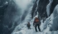 Rope team climbers dressed in climbing clothes,safety harnesses under frozen vertical waterfall icefall during high mountanaring Royalty Free Stock Photo