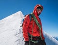 Rope team happy smiling man in climbing harness dressed red mountaineering clothes Last steps before Mont Blanc Monte Bianco