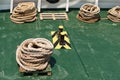 Rope teirs on the green sea vessel deck Royalty Free Stock Photo