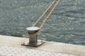 The rope that tied the boat to the metal pole Royalty Free Stock Photo