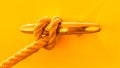 Rope Tied in Loop Around Cleat on a Boat in Gold and Yellow Royalty Free Stock Photo