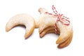 Rope tied pile of traditional Vanillekipferl vanilla kipferl cookies isolated on white background