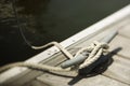 Rope tied to cleat on dock