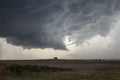 A rope tornado funnel dissipates underneath the updraft of a supercell thunderstorm. Royalty Free Stock Photo