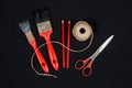 Rope, two red brushes crayons and scissors Royalty Free Stock Photo