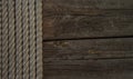 Rope on weathered wood background Royalty Free Stock Photo