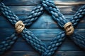 Rope on a wooden background. Rope tied in a knot Royalty Free Stock Photo