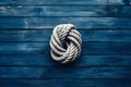 Rope on a wooden background. Rope tied in a knot Royalty Free Stock Photo