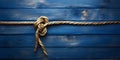 Rope on a wooden background. Rope tied in a knot Royalty Free Stock Photo