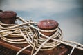 Rope is wound on double bollard on pier